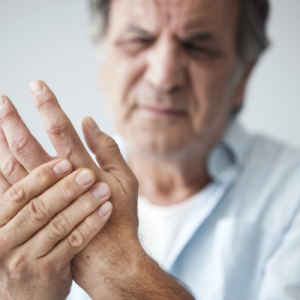 man holding strained hand