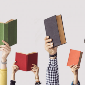 holding up great books for aspiring entrepreneurs