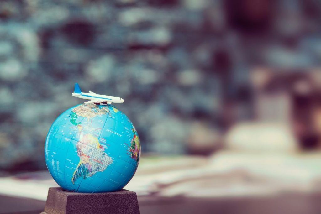 toy plane on globe
