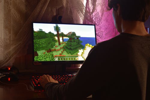 kid playing on computer