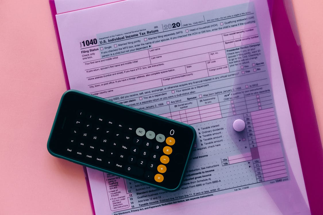 phone calculator lying on form 1040