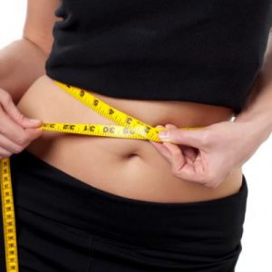 lady with measuring tape around her waist