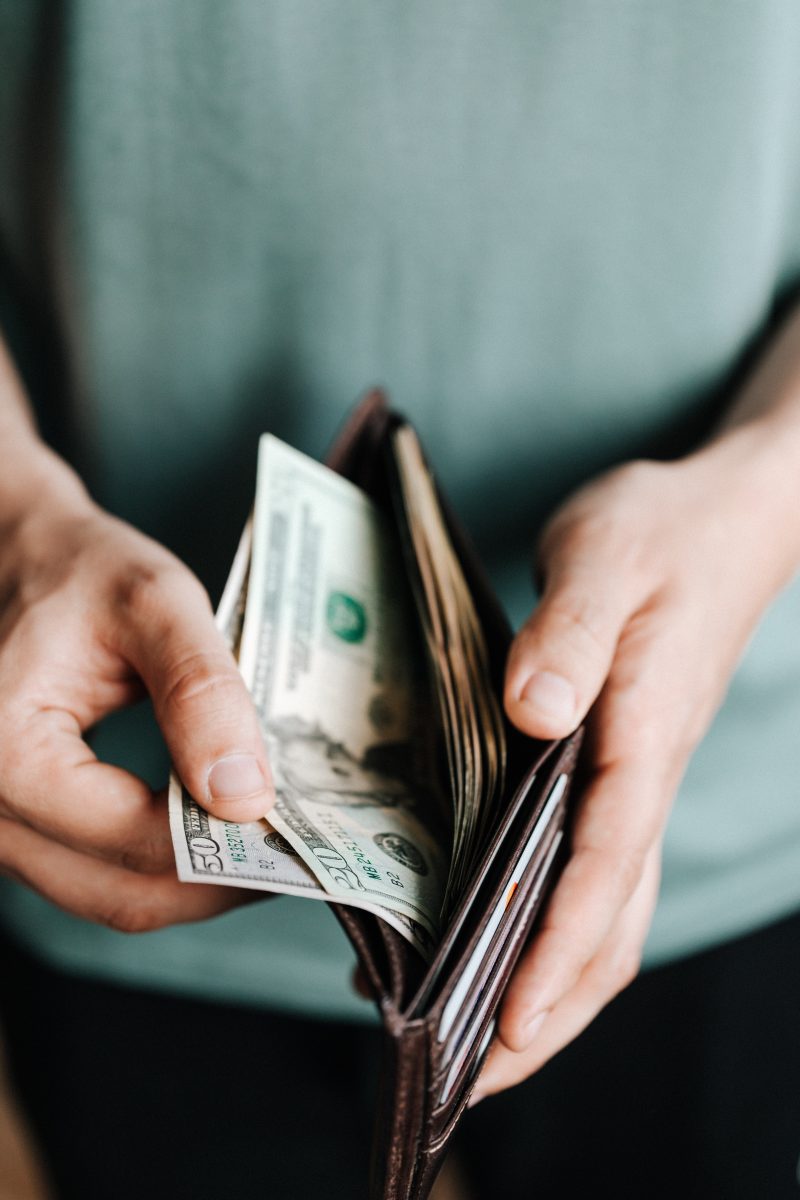 man getting money from his wallet
