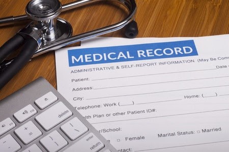 stethoscope with medical record paper and keyboard