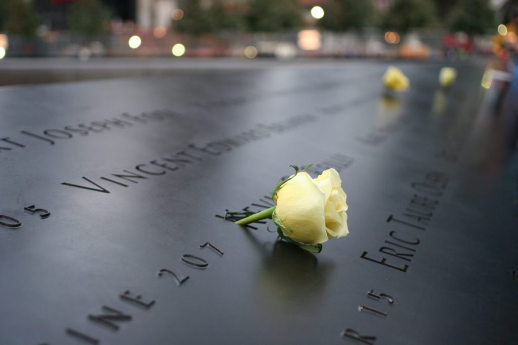 flowers laying on 9/11 memorial