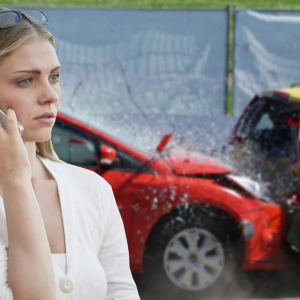 woman using cell phone after crashing car