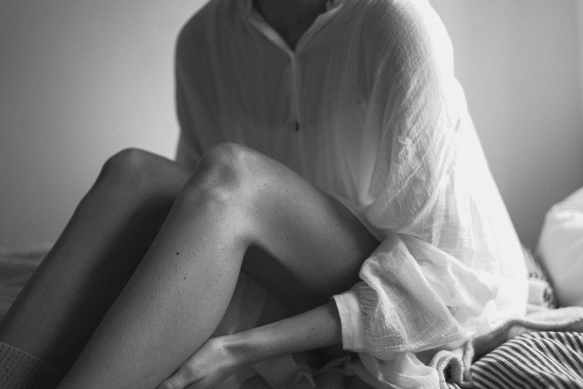 Black and white person sitting
