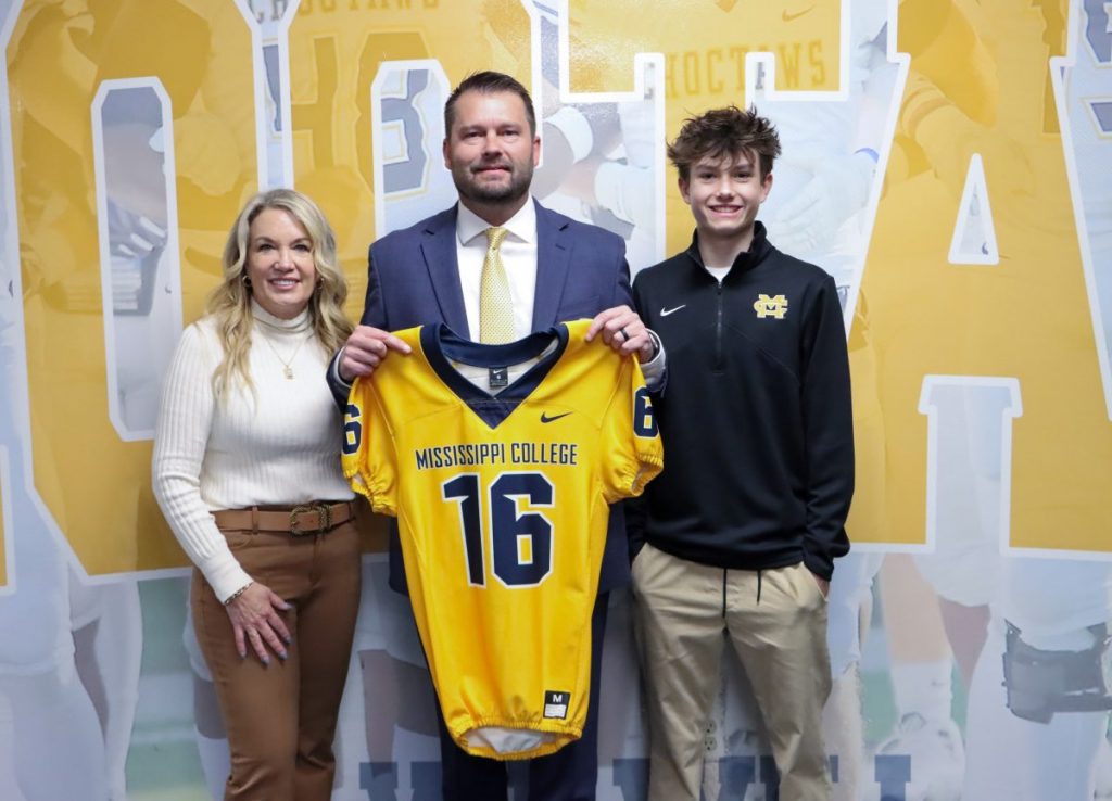 Mike Kershaw (center) has been named the new Mississippi College head football coach. He is pictured with his wife, Kristi (left), and son, Karson (right).
