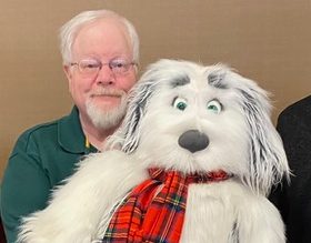 Johnny Lowe, accompanied by his puppy friend Homer, served as a December presenter at the Clinton Quisenberry Library.