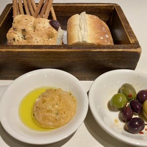 WHITE BEAN HUMMUS - Becco Italian's white bean hummus, olive bread and breadsticks are the perfect start to any meal at the NYC eatery.