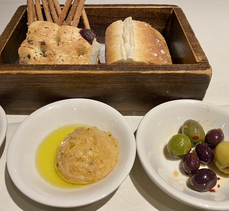 WHITE BEAN HUMMUS - Becco Italian's white bean hummus, olive bread and breadsticks are the perfect start to any meal at the NYC eatery.