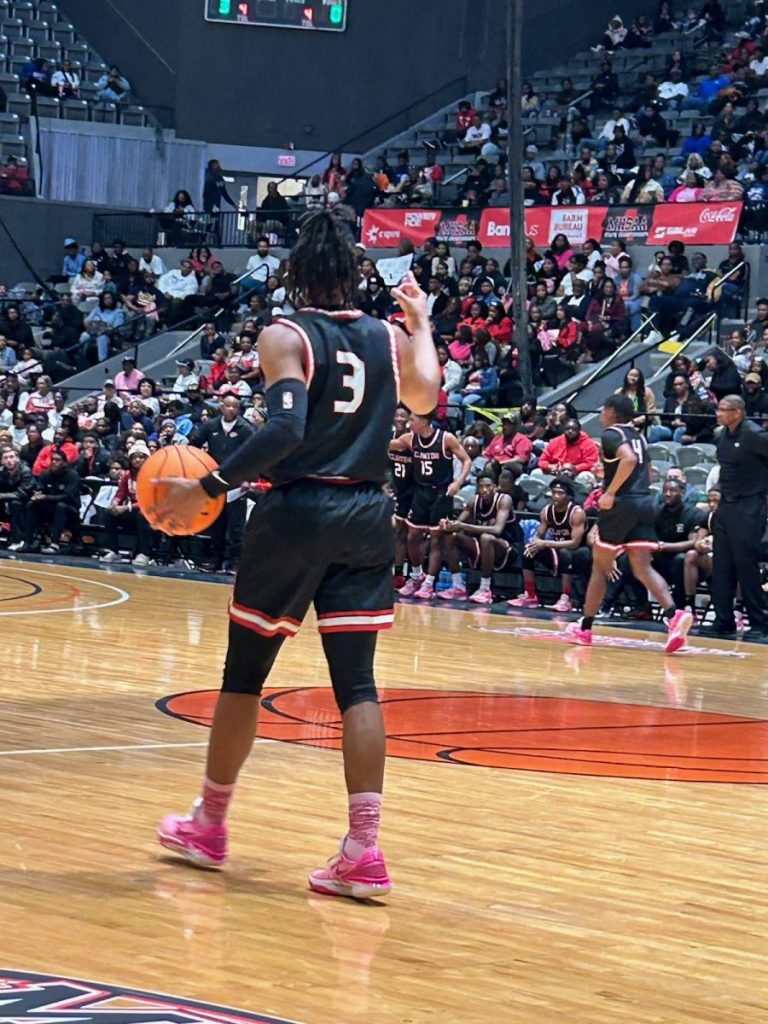 Trey Alexander takes the basketball down the court against Meridian in the Class 7A championship game.