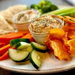 Greek dip duo at Keg and Barrel in Hattiesburg is a delicious combination of hummus and feta dip, homemade pita bread and chips and crisp vegetables.