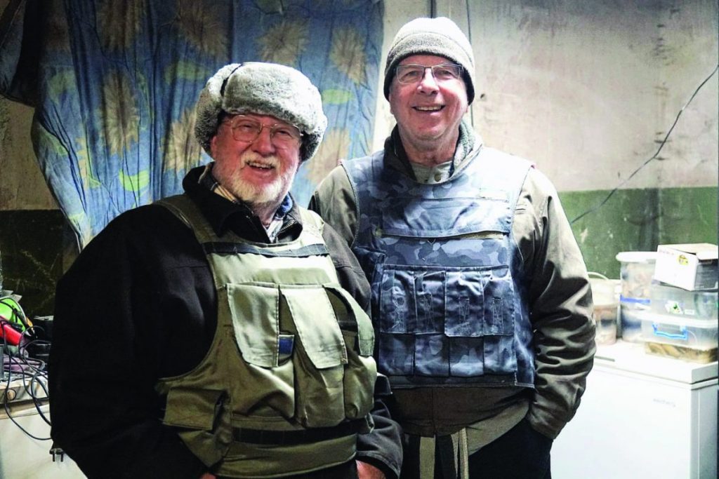 Bob Gilmore (left) and Russell Kyzar (right), pictured in a bunker, the basement of a bombed-out apartment complex, where they visited Ukrainian soldiers. The team visited villages along and between the frontlines of the war. The men have made two trips to Ukraine, working with local pastors to share supplies, encouragement and the gospel. 