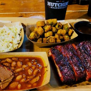 Delicious ribs, cole slaw, fried oka and barbecue beans at Hutchins BBQ in Frisco, Texas.