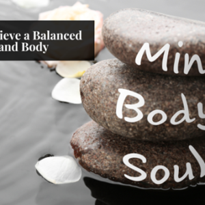 mind body and soul written on rocks in the water