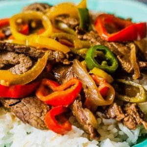 Pepper Steak over Rice is light enough for a summer meal and can cook in the Crockpot during the day, getting dinner on the table in no time.