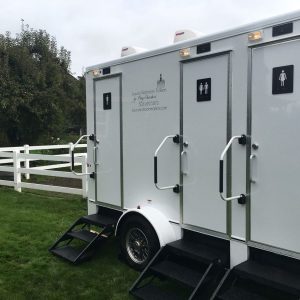 three stall white luxury restroom trailer