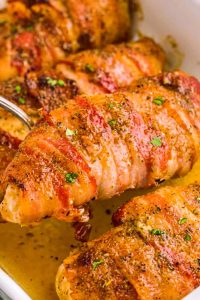 Bacon-wrapped chicken on a bed of dried beef slices is a tasty dinner alternative to frozen or drive-through options.