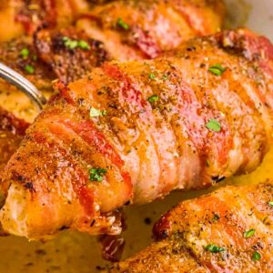 Bacon-wrapped chicken on a bed of dried beef slices is a tasty dinner alternative to frozen or drive-through options.