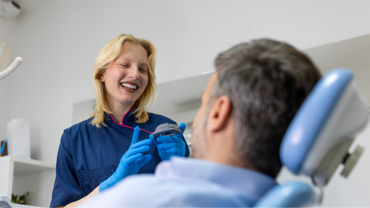 invisalign female dentist with male patient