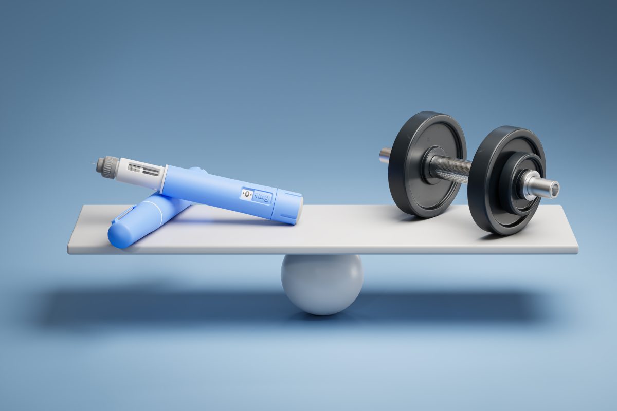 2 needles and a barbell sitting on a seesaw