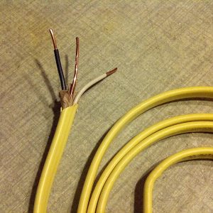 yellow cord with wires exposed