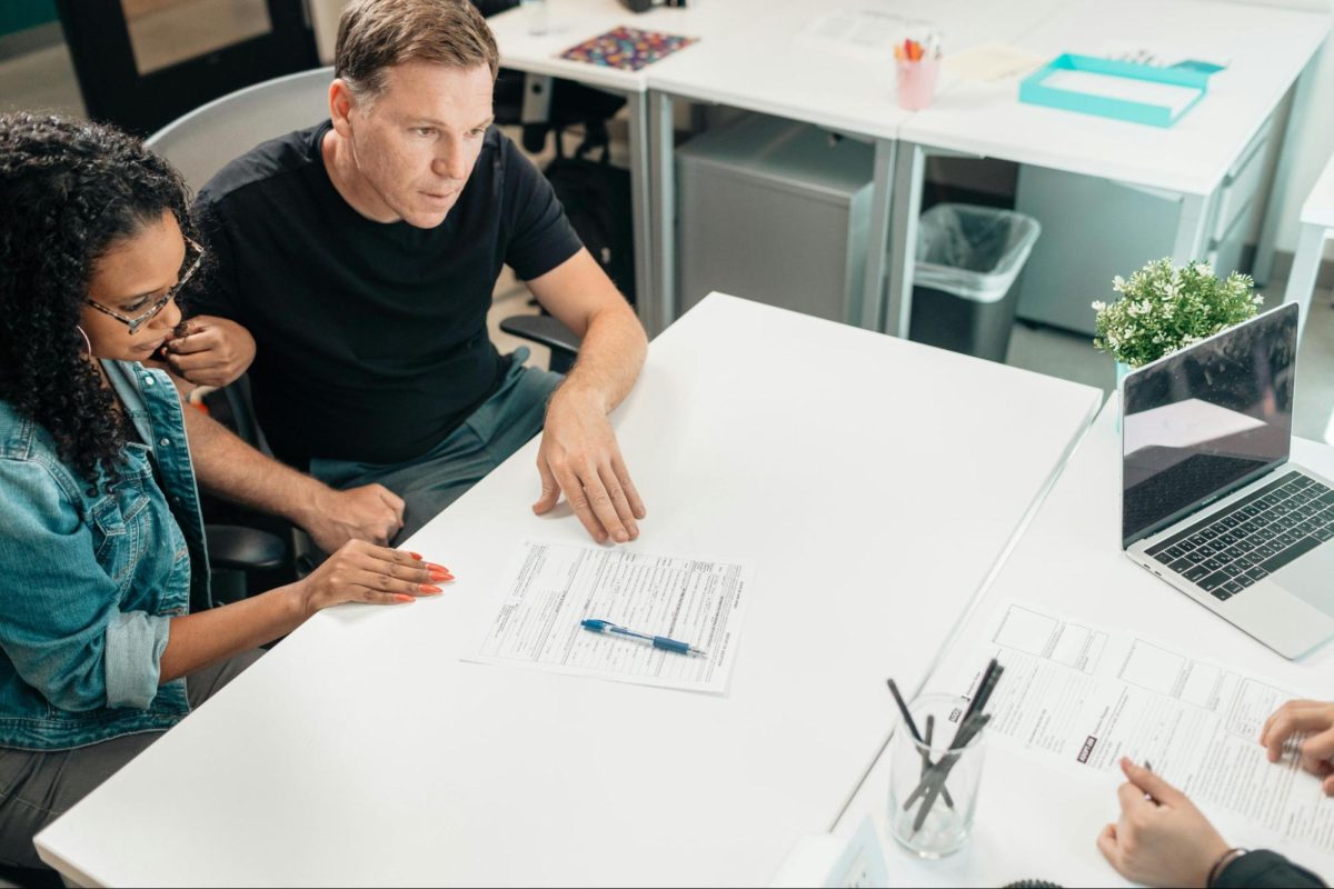 new business owner couple sit down with legal planner