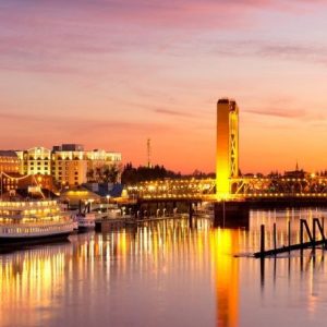 lights over sacramento california with a sunset in the background