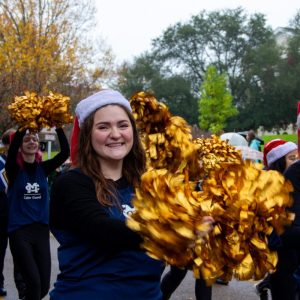 Mississippi College Color Guard member Lily Meadows marches in the parade alongside her teammates.