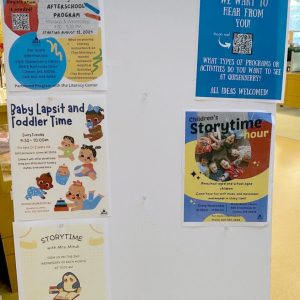 Programs and announcements are shown on the Quisenberry Library entry easel.