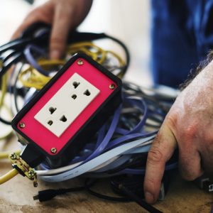 electrician with many wires bundled together sitting on a table
