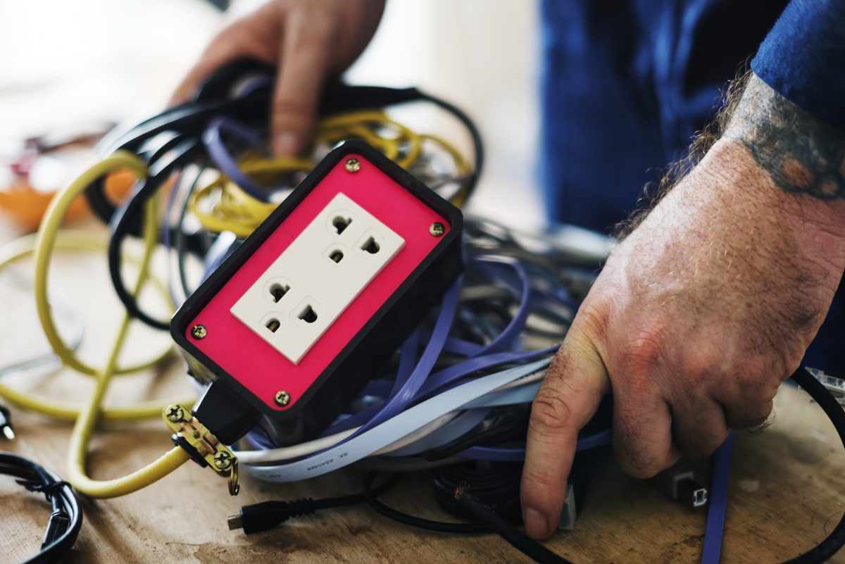 electrician with many wires bundled together sitting on a table