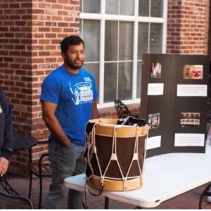 MC students Lauren Ben, Taylor York, center, and Brodie Ben share insights into their Choctaw heritage during a "Culture in the Courtyard" presentation.