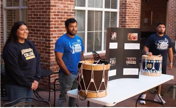 MC students Lauren Ben, Taylor York, center, and Brodie Ben share insights into their Choctaw heritage during a "Culture in the Courtyard" presentation.