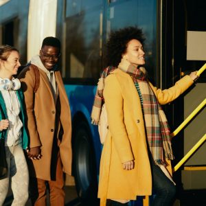 people getting on to a bus