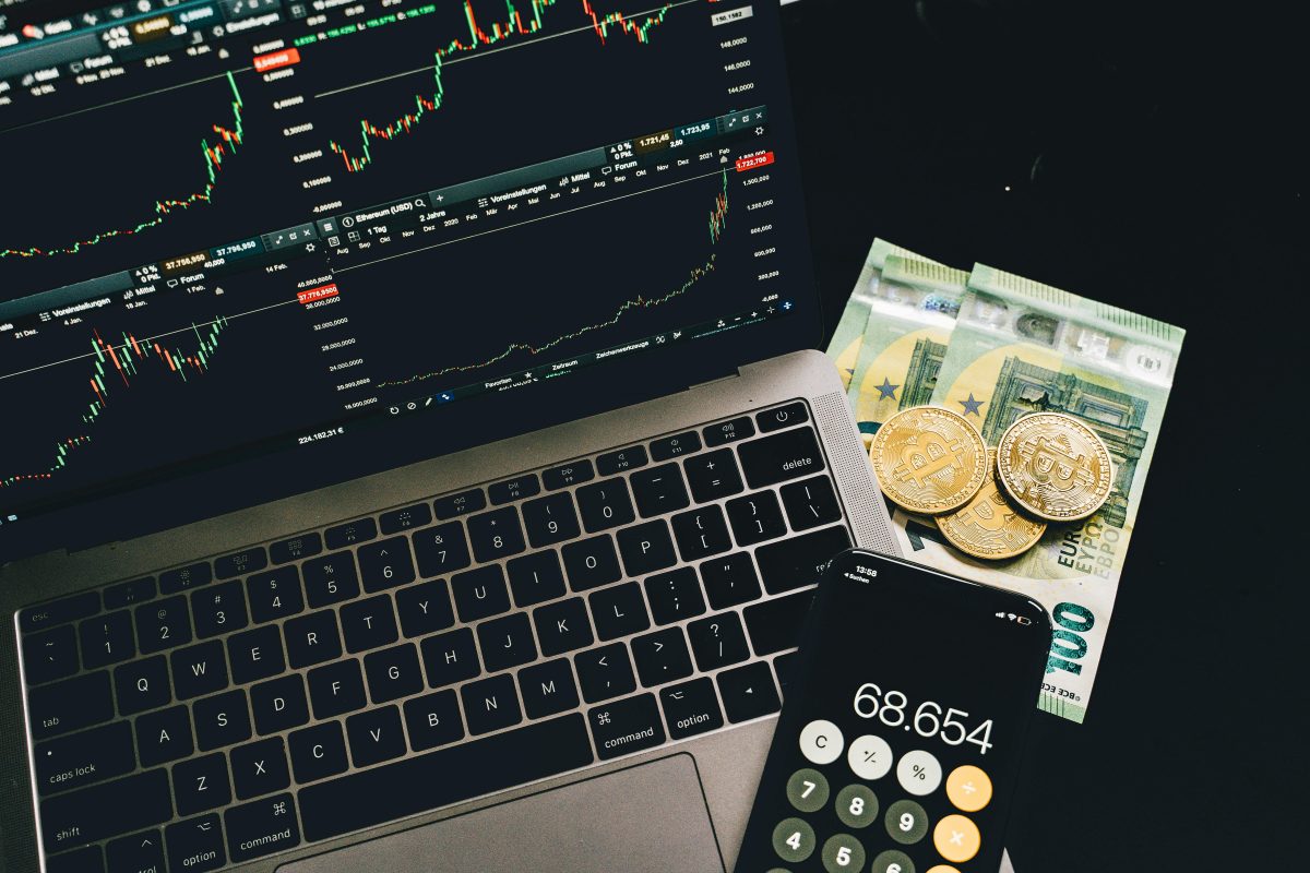 blockchain photo with computer, calculator and money