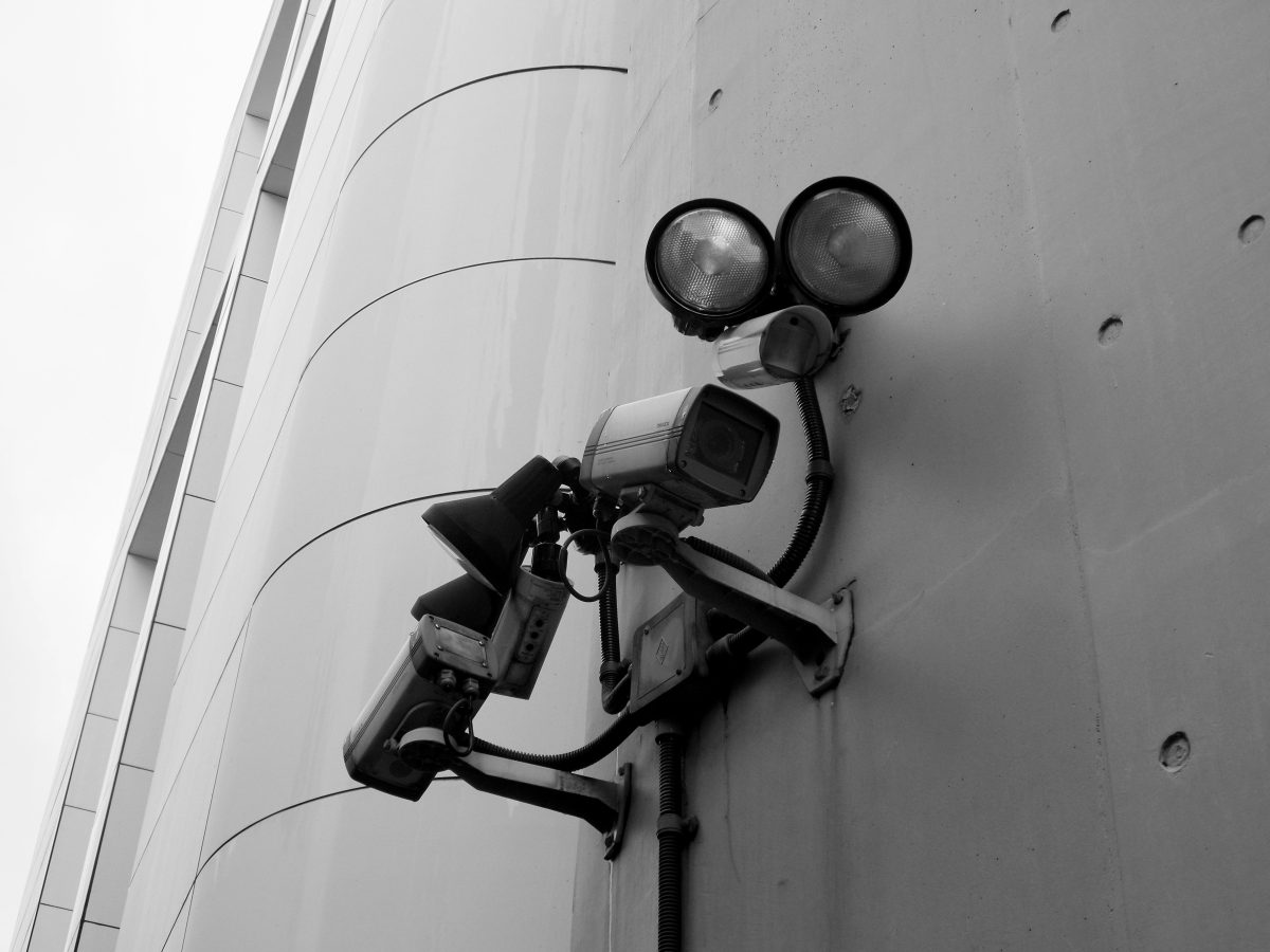 security cameras attached to the side of a building