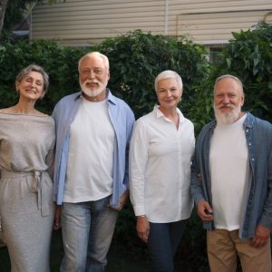 family smiling at camera