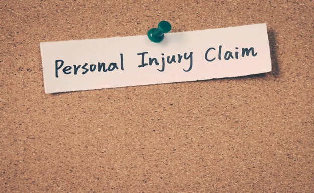 personal injury claim written on paper tacked to a bulletin board