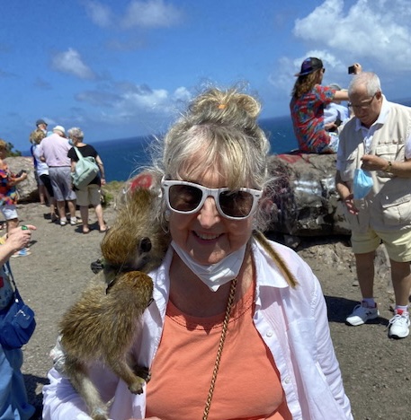 Special to The Clinton Courier Carole is joined by some playful monkeys during a photo from one of her many adventures.