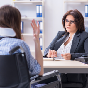 injured woman sits with professional