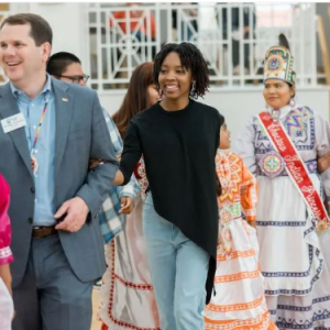 Mississippi College President Blake Thompson and Camryn Johnson, center, MC admissions counselor, join in a social dance with members of the Mississippi Band of Choctaw Indians during a previous Choctaw Expressions.