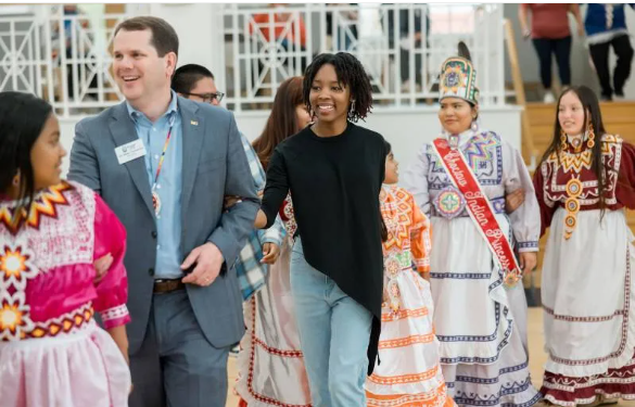 Mississippi College President Blake Thompson and Camryn Johnson, center, MC admissions counselor, join in a social dance with members of the Mississippi Band of Choctaw Indians during a previous Choctaw Expressions.