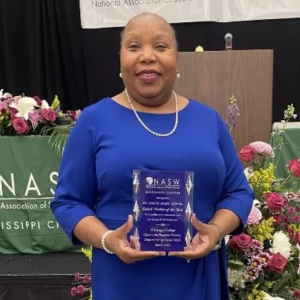 Laurie Smith Lawson displays the Social Worker of the Year Award she received from the Mississippi Chapter of the NASW.
