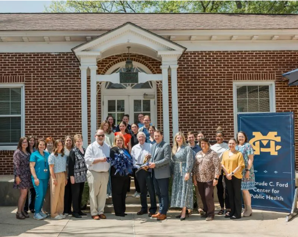 Mississippi College President Blake Thompson, members of MC’s Board of Trustees, special guests, and faculty and staff in the MC School of Nursing celebrate the opening of the Gertrude C. Ford Center for Public Health.