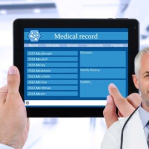 doctor holding a tablet showing medical record