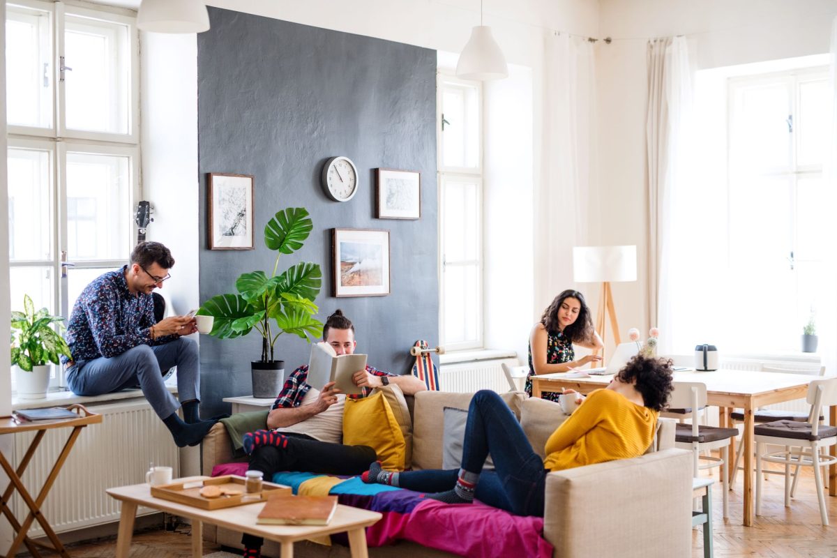 roommates sit together in living room