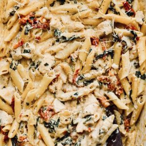 This delicious, easy-to-make dish filled with chicken, pasta, tomatoes, spinach and cheese is the perfect make-ahead dish to throw in the cooler and take to the beach for reheating for a quick meal.