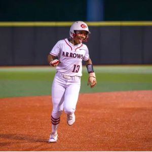 Makenzie Cooley rounds second base after hitting a home run for the Lady Arrows.